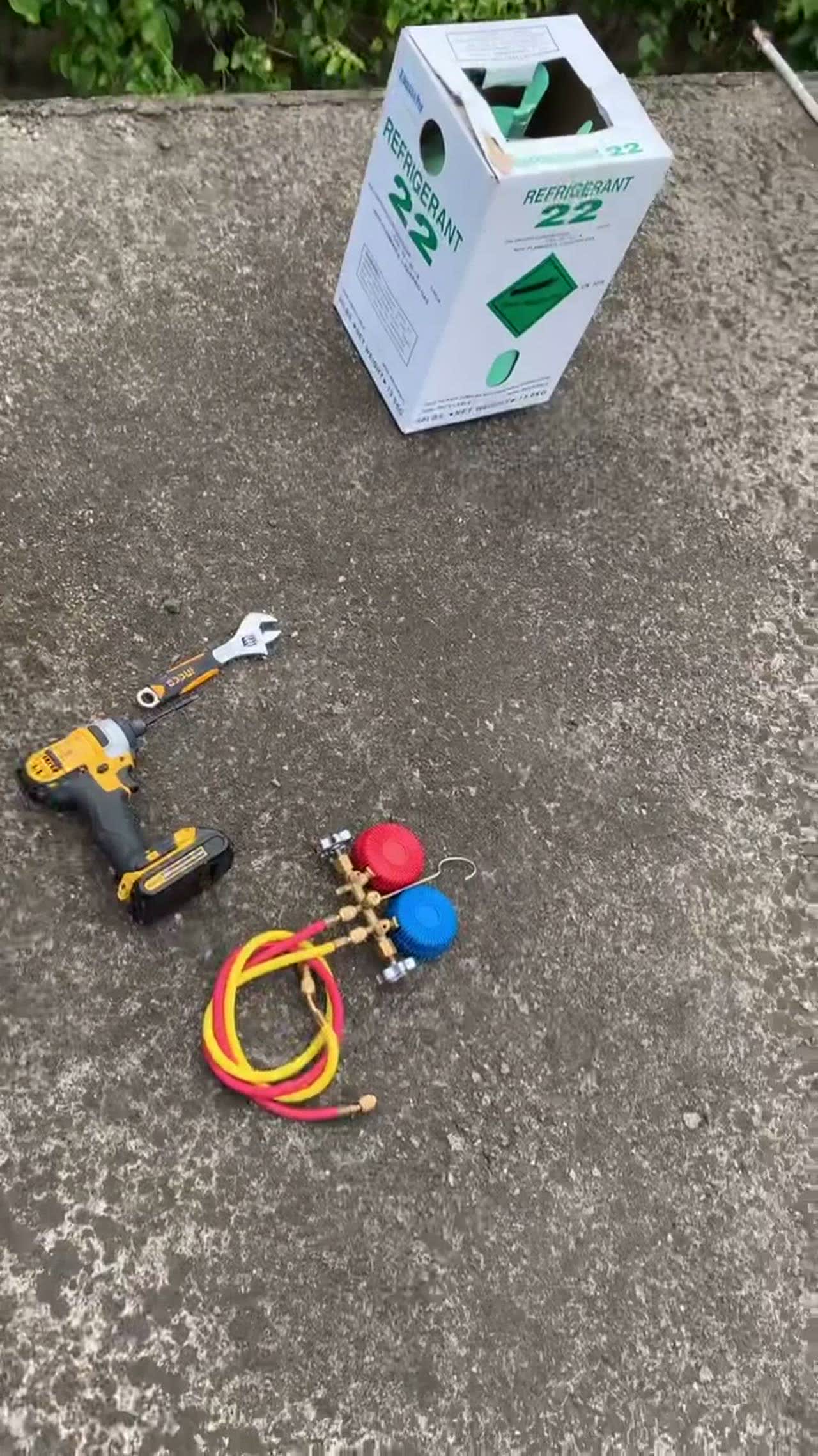 AC repair tools and gauges on site